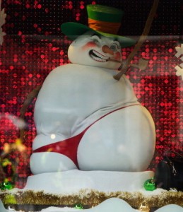 LONDON, ENGLAND - NOVEMBER 24: A man stands next to a Christmas window display on Oxford Street on November 24, 2012 in London, England. Oxford Street was closed to traffic for its annual pedestrian only Christmas Shopping. (Photo by Bethany Clarke/Getty Images)
